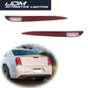 A close-up view of a red rear bumper reflector light cover for a Chrysler 300 vehicle.