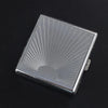 A silver stainless steel cigarette case with an embossed sunburst pattern shown from above.