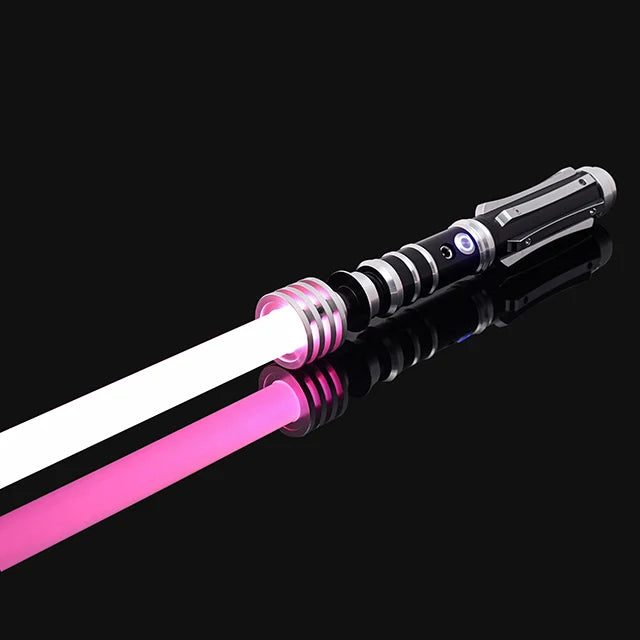 A close-up of an RGB metal lightsaber with a pink blade and black hilt against a dark background.