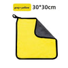 A yellow and gray microfiber car cleaning towel folded into a square shape.
