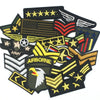 A collection of tactical embroidered patches featuring military insignia and emblems.