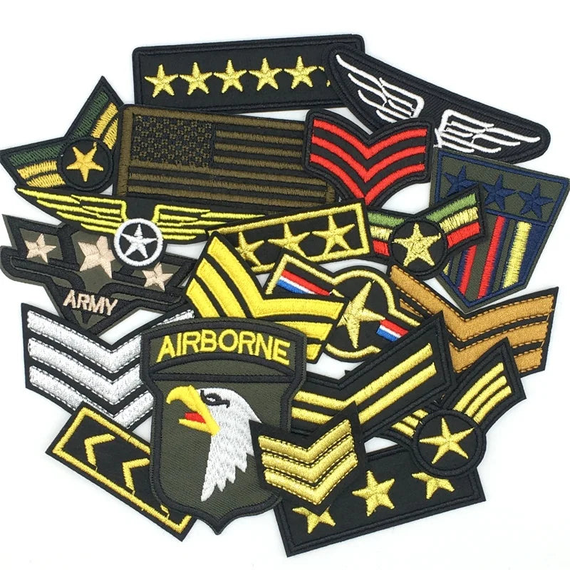 A collection of tactical embroidered patches featuring military insignia and emblems.