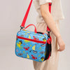 A bright blue insulated lunch bag with a yellow and red nautical theme is being carried by a person.
