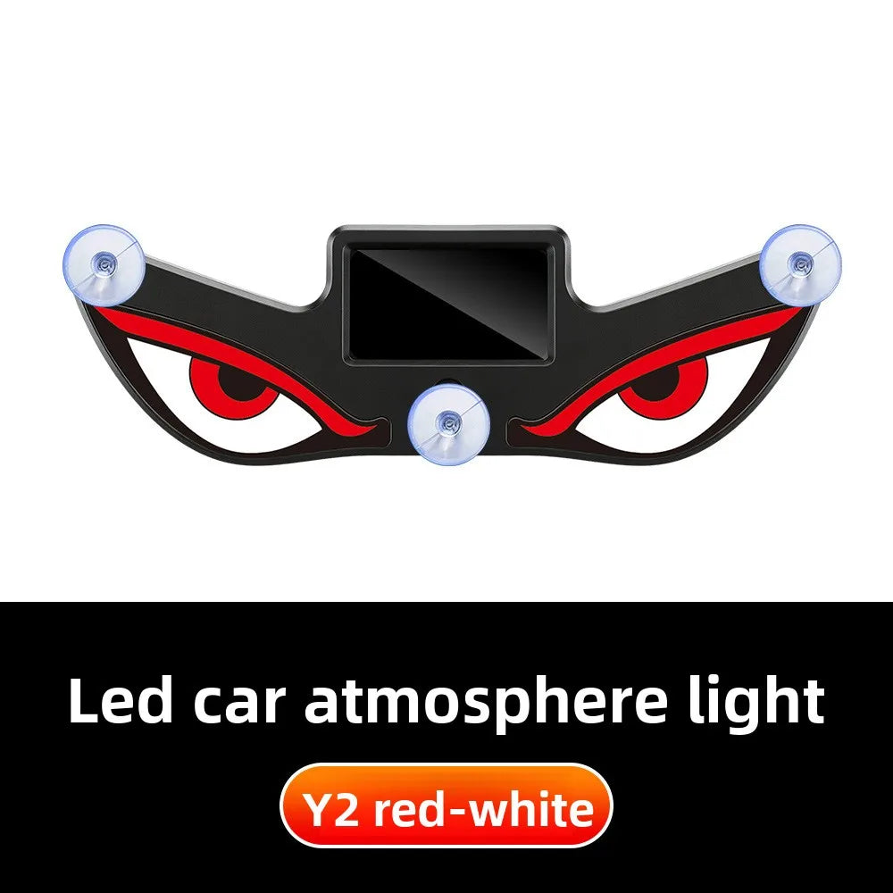 A black demon eye LED car window decal with red and white lights.