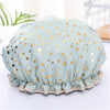 Light blue reusable elastic shower cap with gold polka dots