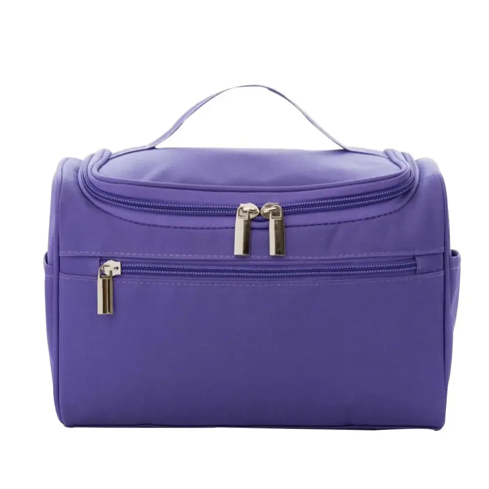 A purple waterproof hanging makeup bag with a zipper and gold hardware.