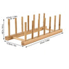 A wooden bamboo dish drying rack with multiple slots for drying dishes.