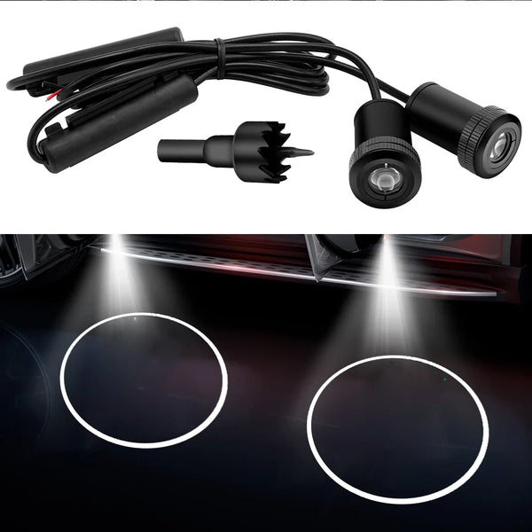 Two car door logo projector lights with cables and LED beams illuminating a surface.