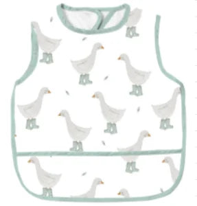 A white waterproof full-body baby feeding bib with a sleeveless design featuring several small white ducklings.