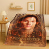 A blanket featuring a portrait of Sam Winchester from the Supernatural TV show on a dark background.