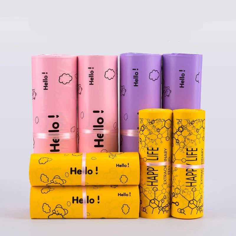 A collection of purple and yellow self-sealing mailing bags featuring a Hello bear design.