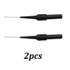 Two black multimeter back-piercing test probes with 30V markings and needle tips.