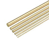 A collection of parallel brass bar rods or wires arranged diagonally.