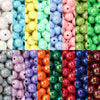 A vibrant assortment of round acrylic beads in various colors including pink, yellow, blue, green, and red.
