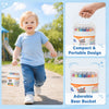 A toddler is holding a compact and portable bear bucket of colorful crayons outdoors.