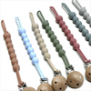 A set of food-grade silicone pacifier clips with anti-lost chains in various pastel colors like pink, green, and blue.