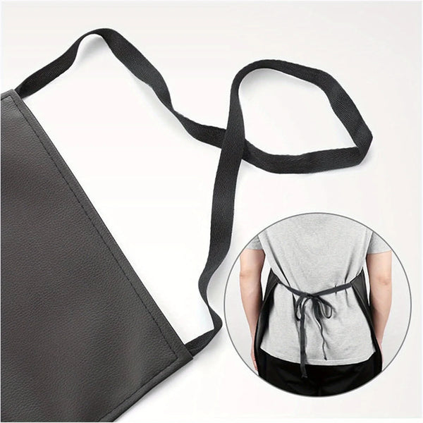A black PU leather waterproof apron with adjustable straps shown next to a person wearing it.