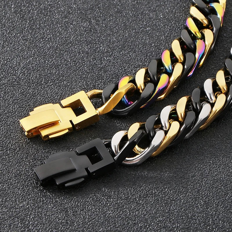 A close-up of a chunky stainless steel Cuban chain bracelet featuring black and gold links.