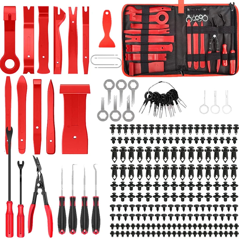 A red and black car trim removal tool kit with various tools and storage pouch.