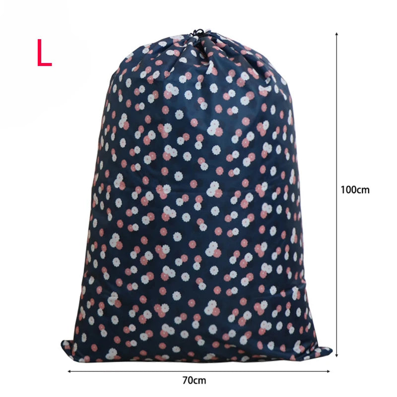 A dark blue drawstring laundry bag with a white floral pattern, shown from the front.