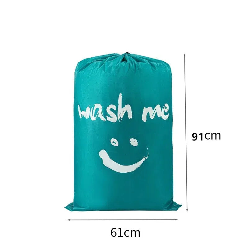 Teal drawstring laundry bag with white text 'wash me' and dimensions 91cm by 61cm.