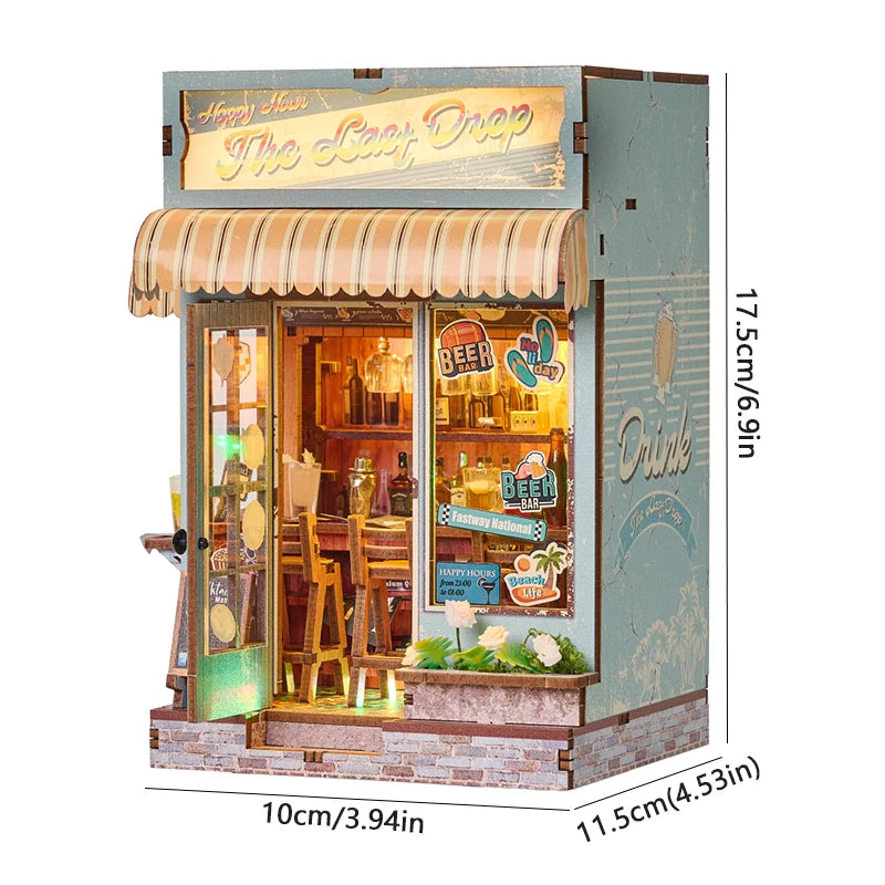 A miniature DIY book nook kit featuring a detailed shelf scene with a wooden facade and glass display.