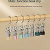 A set of multi-function hook clips made of stainless steel are displayed hanging on a wooden rod.