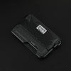 A black minimalist leather card holder with a bottle opener is shown from above.
