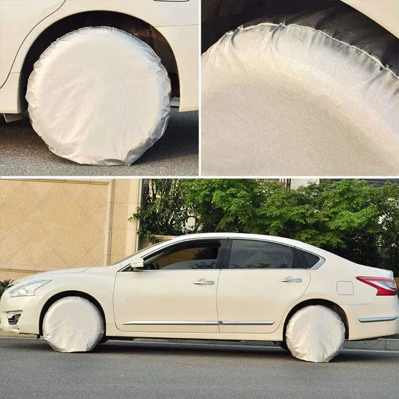 A white sedan with four universal tire covers installed, showing the protective plastic covering the tires.