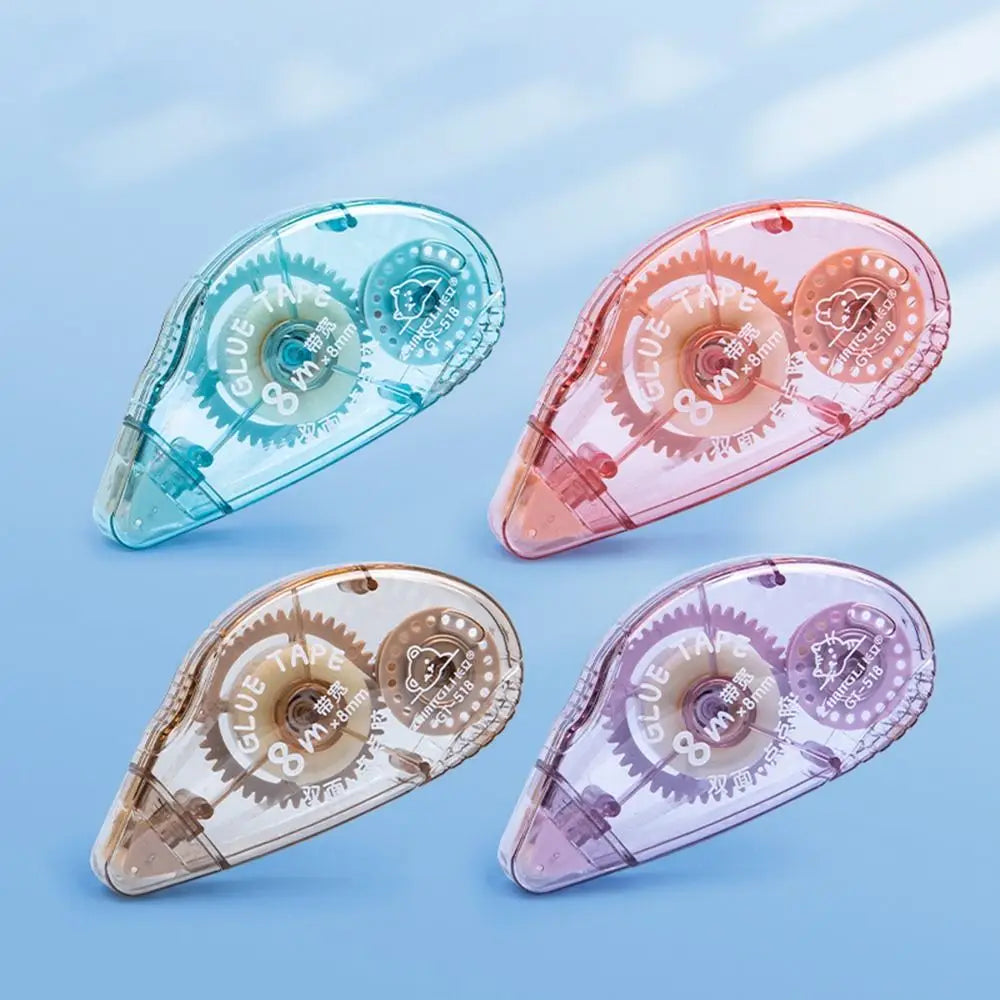 Three clear adhesive tape rollers in blue, pink, and purple shades shown at an angle