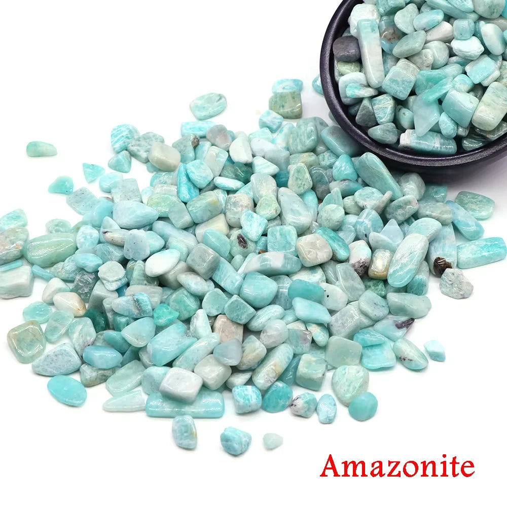 A pile of light blue Amazonite crystal chips and tumbled stones.