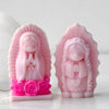 Pink silicone mold of a praying girl figure used for candles, soap, and craft decor
