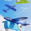 A hand holds a blue Dinosaur Foam Airplane Gun toy, ready to launch an airplane model.