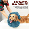 A dog is lying on a blue pet bath towel, demonstrating the quick-drying feature.