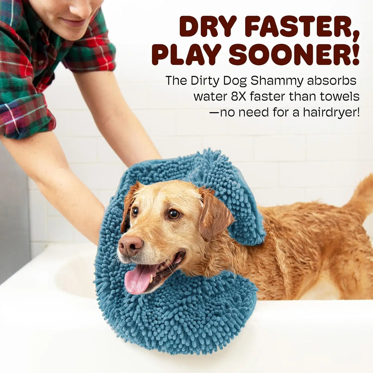 A dog is lying on a blue pet bath towel, demonstrating the quick-drying feature.