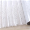Roll of white decorative frosted window privacy film with a diamond pattern