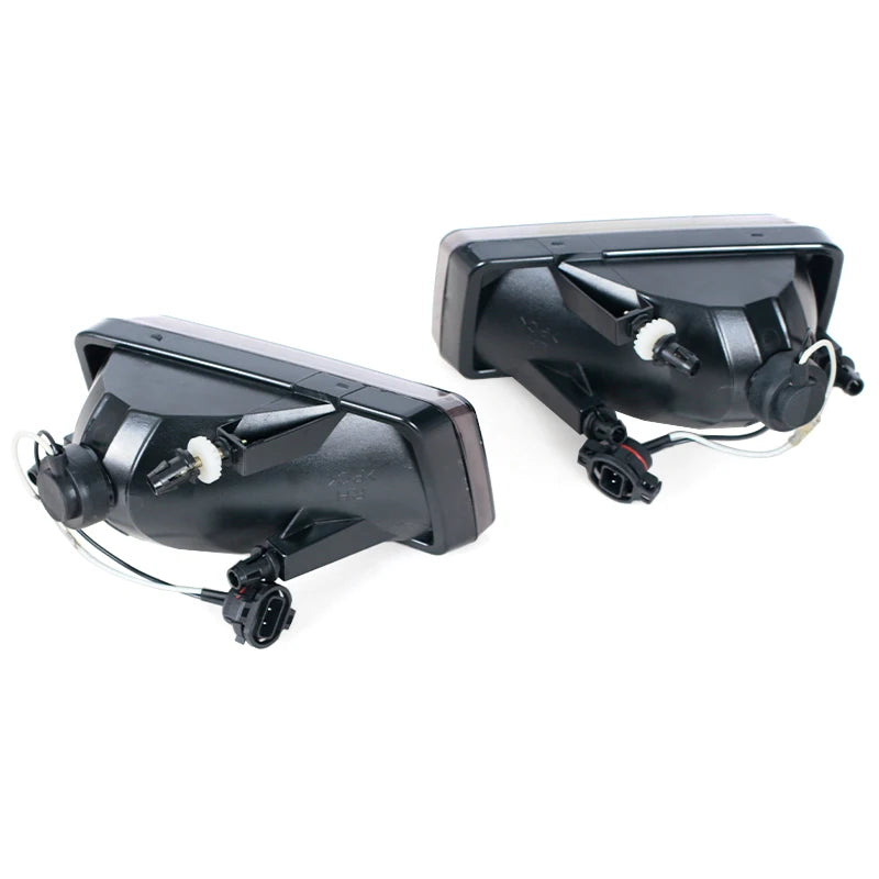 Black direct-fit fog light assembly for Chevy Silverado, Tahoe, Suburban, and Avalanche.