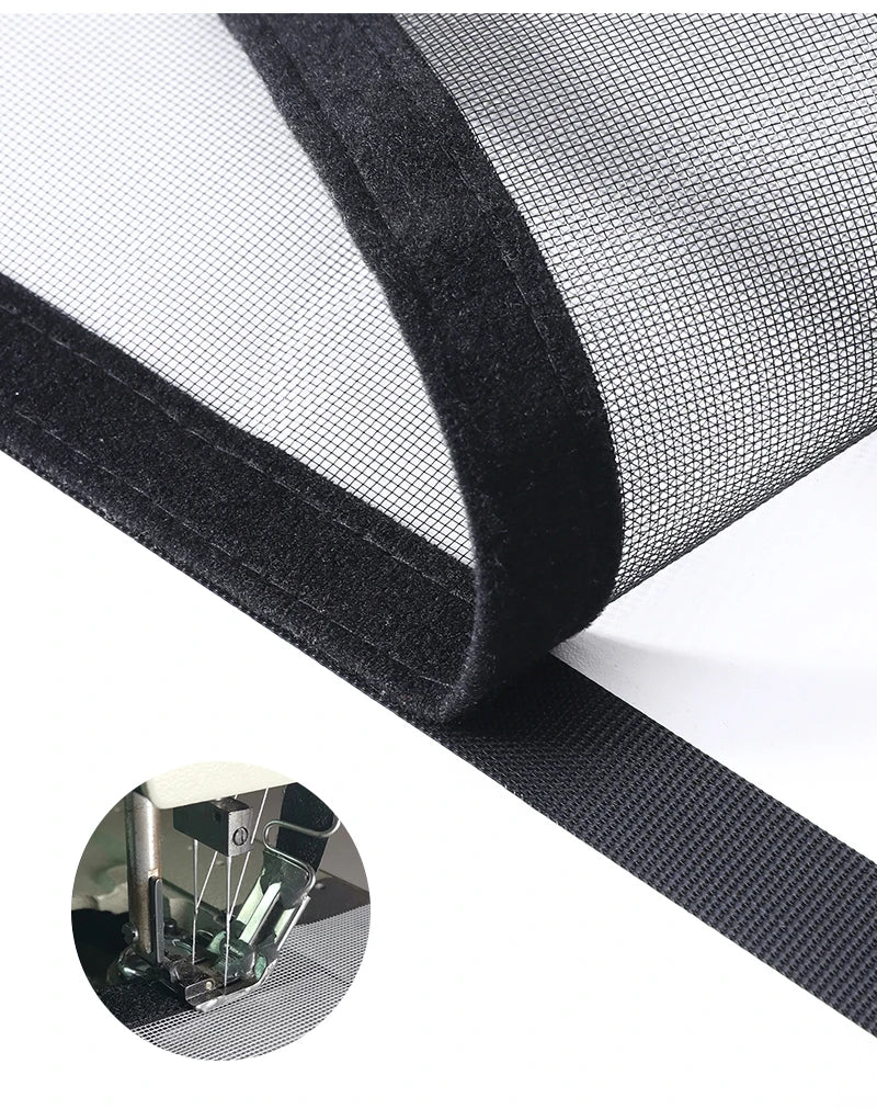 Close-up view of a black self-adhesive mosquito net window screen with a zipper detail.
