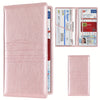 A pink leather slim card holder wallet containing vehicle registration, license, and insurance cards.