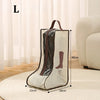A beige tall boot storage bag with a brown handle and clear plastic window is shown on a light rug.