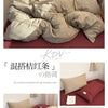 A set of minimalist striped 100% cotton bedding featuring beige and terracotta tones.