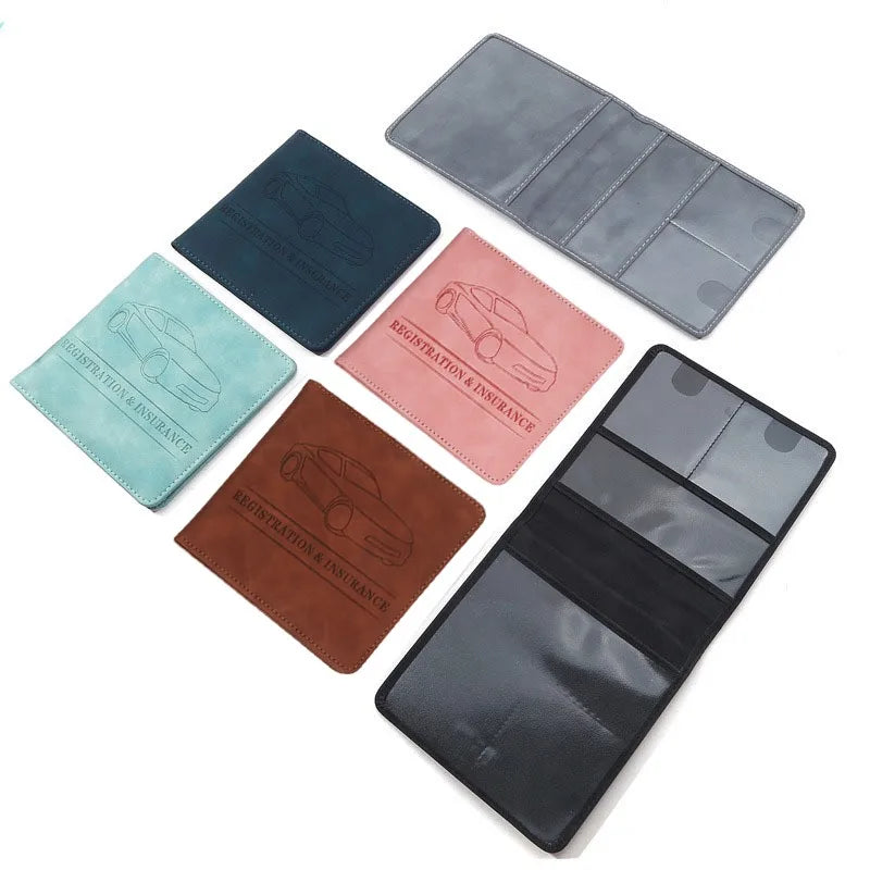 A set of five slim card holder wallets in various shades of blue, gray, and brown for vehicle registration and insurance card