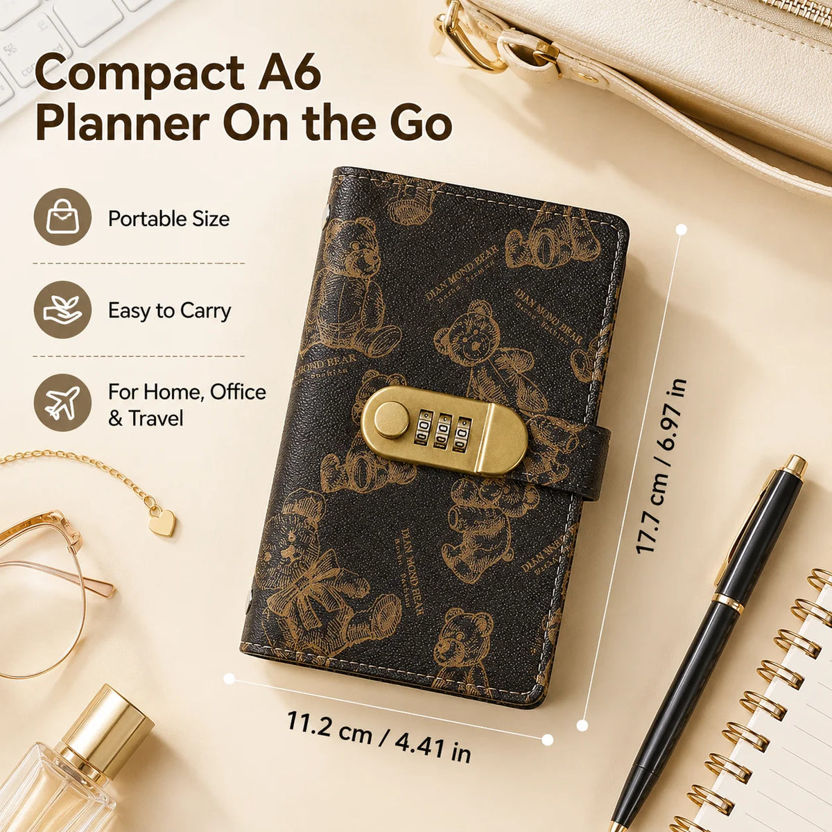 A compact A6 planner on the go featuring a dark brown leather cover with a cartoon bear design and a brass lock.