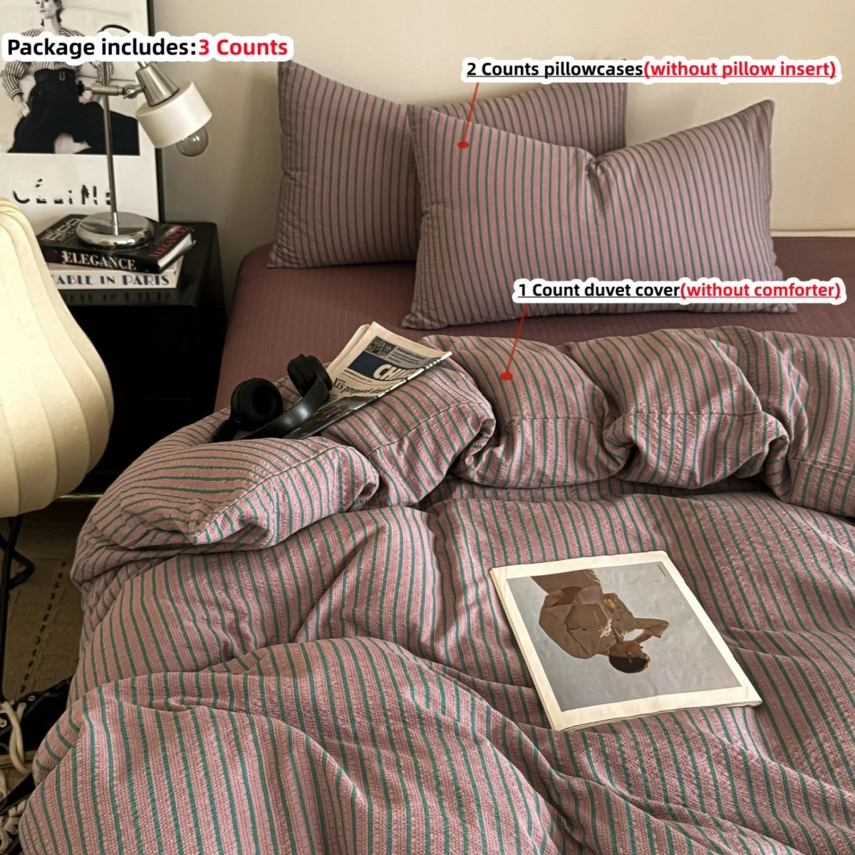 A striped mauve duvet cover set with three pillowcases and a comforter shown on a bed.