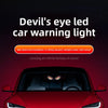 A red car with a devil's eye LED warning light installed on the window.
