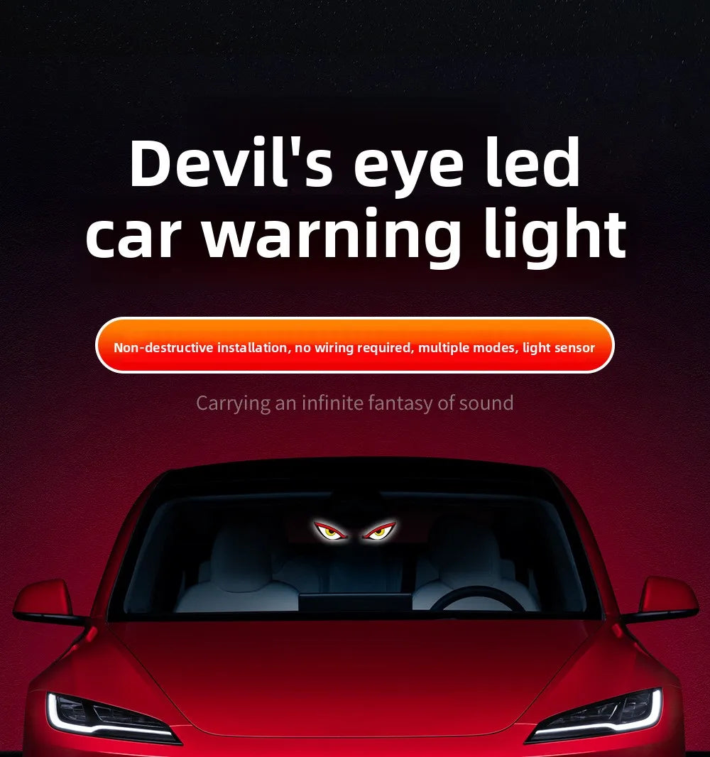 A red car with a devil's eye LED warning light installed on the window.
