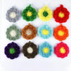A collection of colorful acrylic non-stick dish sponges in various shades including green, yellow, red, purple, and orange.