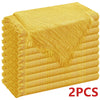 A stack of six golden yellow raw-edge polyester cloth napkins.