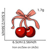 A set of embroidered cherry iron-on patches, pink and red, measuring 6.5cm by 2.56inch.