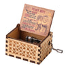 A hand-cranked wooden music box featuring a card with the text You Are Braver Than You Believe and My Sunshine.